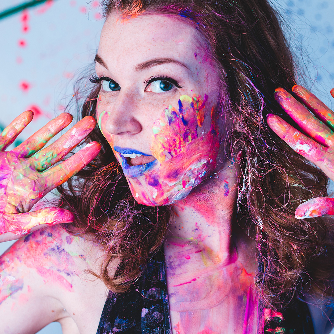Girl with paint splattered on her