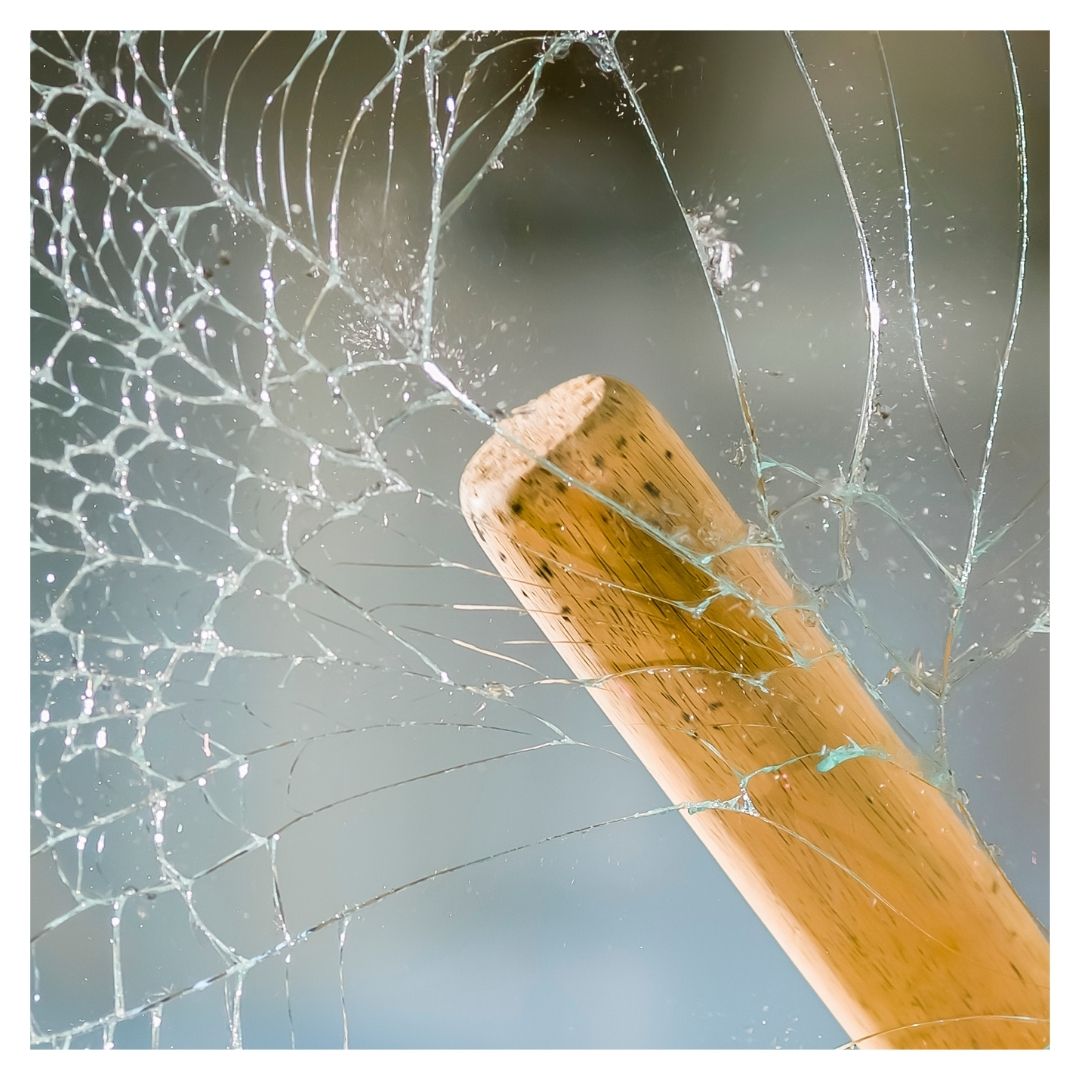 Breaking glass with a baseball bat