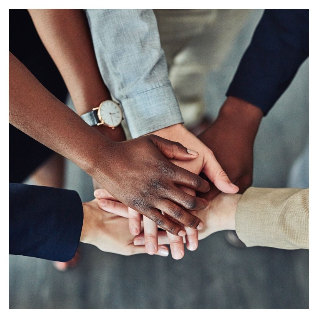 Team putting hands together