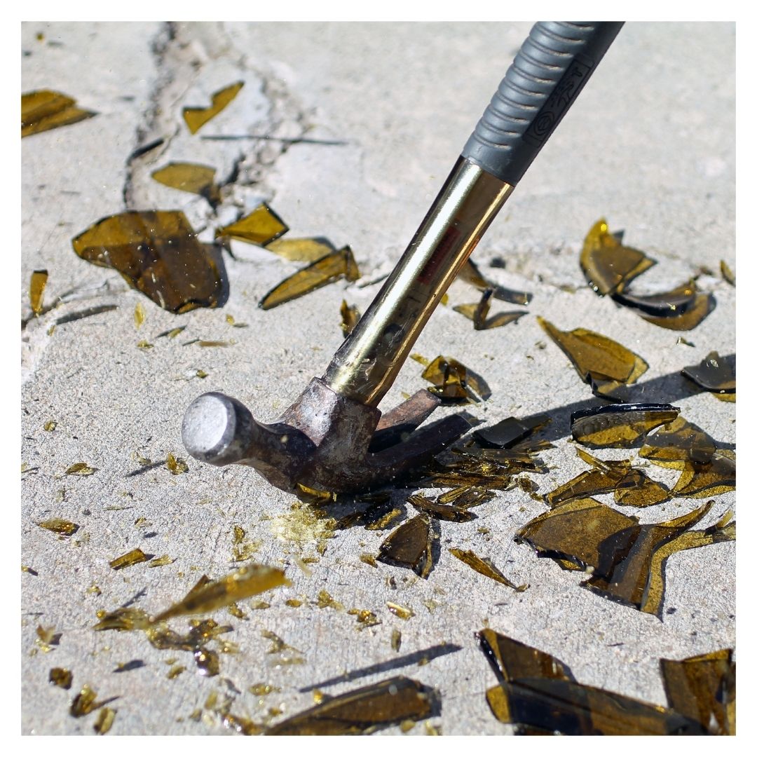 Breaking glass with a hammer